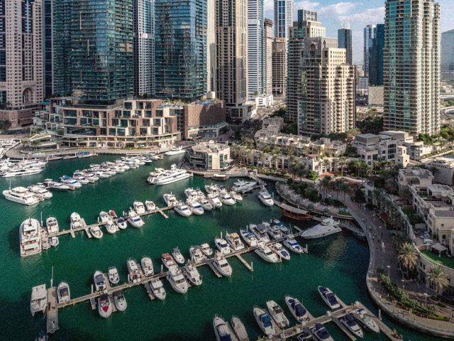 Dubai Marina towers and yachts from above, best aparthotels in Dubai