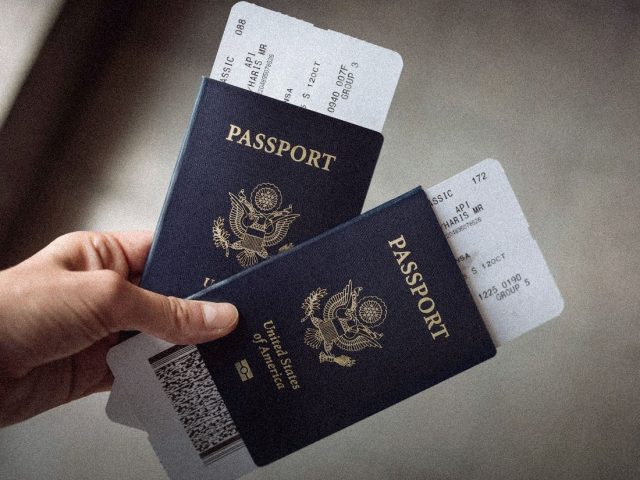 Two US passports with boarding passes, best travel insurance for US residents