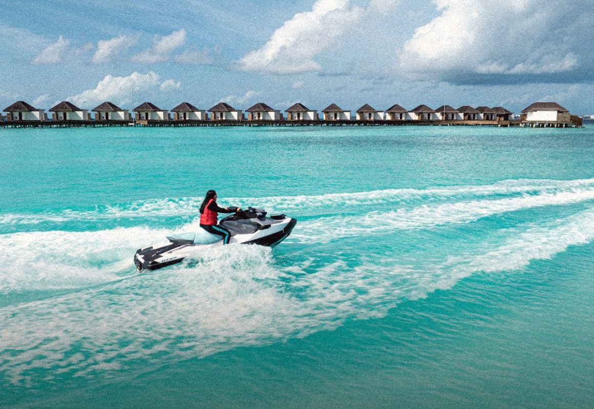 Jet ski on turquoise water by overwater villas, jet ski destinations
