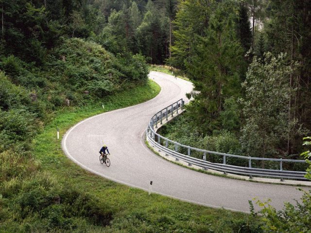 Cyclist on a winding road through a forest, OsmAnd offline maps review