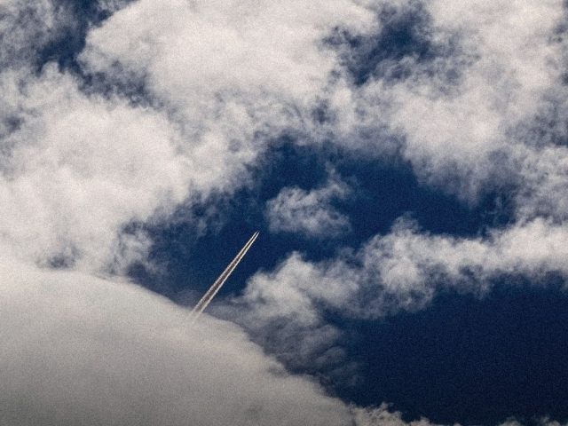 Jet and contrail above white clouds, Plane Finder review