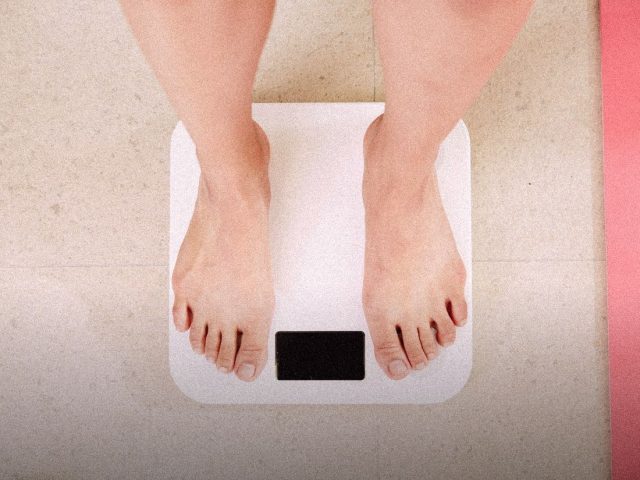 Bare feet on a white digital bathroom scale, RENPHO MorphoScan review