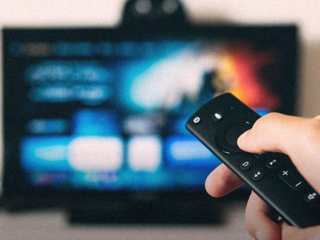 Remote control pointed at a streaming TV, Rocket Money review