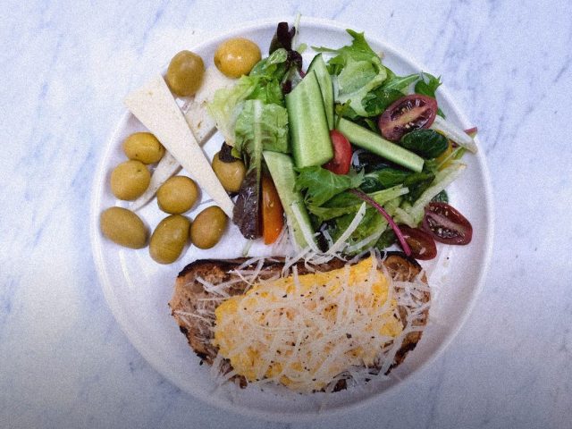 Plate of salad and vegetables on a marble table, SHA Wellness Clinic review