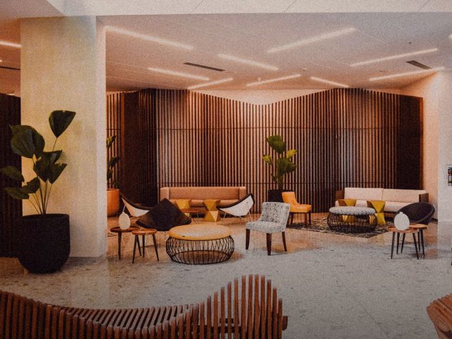 Design hotel lobby with warm wood and plants, Softer Volumes review