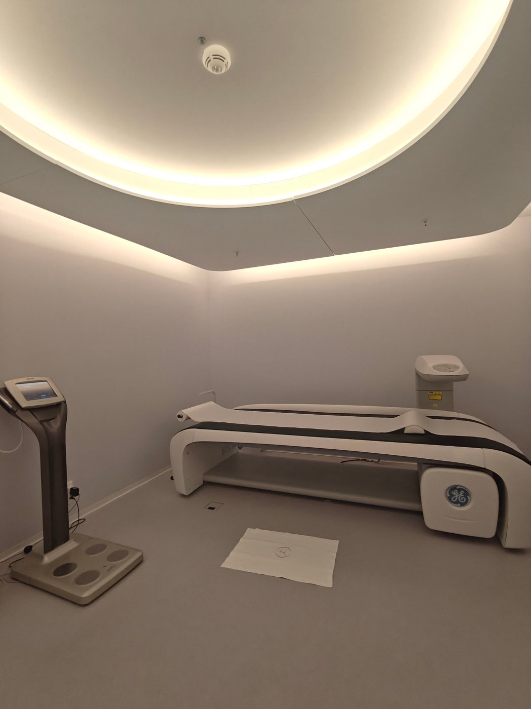 A diagnostics room at Chenot Palace Weggis with a body composition analyser and a GE scanning table